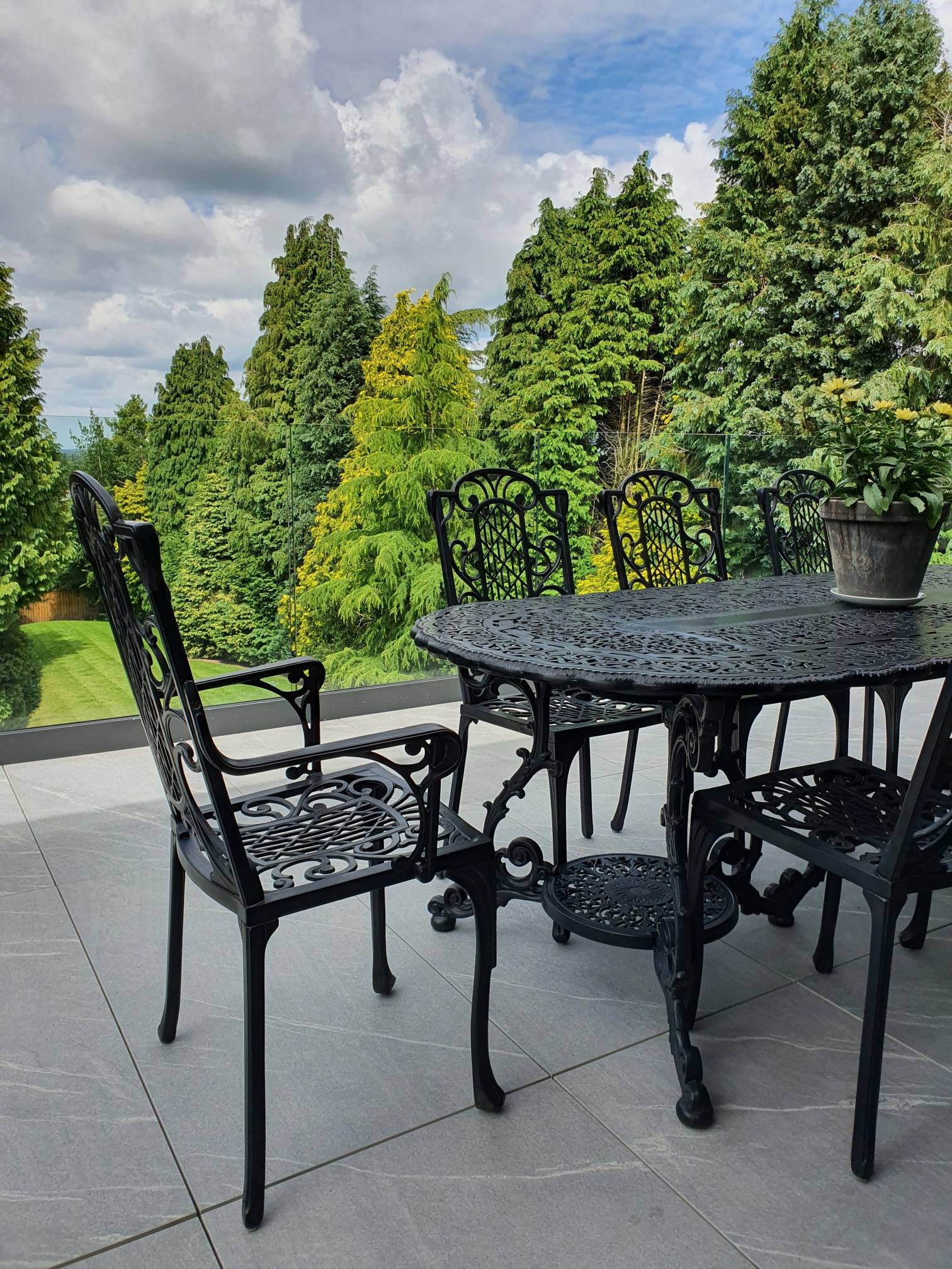 glass balcony with view of garden