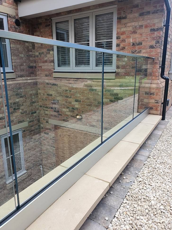 glass balcony with stainless steel handrail and fittings